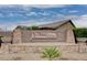 Stone entrance to Solera by Del Webb featuring desert landscaping and a welcoming community sign at 3335 American Mustang Ct, Las Vegas, NV 89122