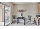 Dining area with sliding glass door to the patio and backyard at 3335 American Mustang Ct, Las Vegas, NV 89122