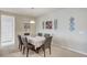 Traditional dining room with neutral color scheme, tile floors and stylish decor at 3335 American Mustang Ct, Las Vegas, NV 89122