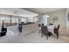 Open concept dining room with view to living room and kitchen at 3335 American Mustang Ct, Las Vegas, NV 89122