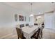 Traditional dining room with neutral color scheme, tile floors and stylish decor at 3335 American Mustang Ct, Las Vegas, NV 89122