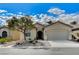 Beautiful single-story home features a low-maintenance front yard with desert landscaping, a covered porch, and an attached two-car garage at 3335 American Mustang Ct, Las Vegas, NV 89122
