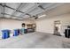 Spacious two-car garage with ample storage space and a well-organized workbench area at 3335 American Mustang Ct, Las Vegas, NV 89122