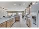 Bright kitchen with countertops, breakfast bar, white appliances and plenty of cabinet storage at 3335 American Mustang Ct, Las Vegas, NV 89122