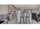 Open concept kitchen with eat-in breakfast bar connecting to living area at 3335 American Mustang Ct, Las Vegas, NV 89122