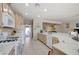 Bright kitchen with countertops, breakfast bar, white appliances and plenty of cabinet storage at 3335 American Mustang Ct, Las Vegas, NV 89122