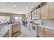 Bright kitchen with countertops, breakfast bar, white appliances and plenty of cabinet storage at 3335 American Mustang Ct, Las Vegas, NV 89122