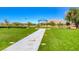Wedding arbor in a grassy area with mountains in the background at 3335 American Mustang Ct, Las Vegas, NV 89122