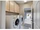 Functional laundry room with a side by side washer and dryer at 3335 American Mustang Ct, Las Vegas, NV 89122