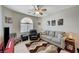 Comfortable living room with neutral walls, a ceiling fan and cozy furniture at 3335 American Mustang Ct, Las Vegas, NV 89122