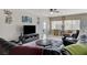 Bright living space, from the dining room, featuring tile flooring and open floor plan at 3335 American Mustang Ct, Las Vegas, NV 89122
