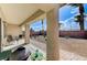 Covered patio overlooking the backyard, perfect for outdoor seating and entertaining with a grill at 3335 American Mustang Ct, Las Vegas, NV 89122