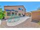 Expansive backyard features a large patio, play structure, and low-maintenance landscaping, perfect for outdoor living at 3525 Dover Bay St, Las Vegas, NV 89129