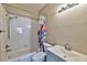 Cozy bathroom featuring a shower-tub combo, vanity with sink, and neutral tones at 3525 Dover Bay St, Las Vegas, NV 89129