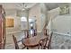 Elegant dining area with hardwood floors, chandelier, and a view of the staircase at 3525 Dover Bay St, Las Vegas, NV 89129