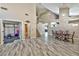 Spacious living room featuring an open layout, staircase, and access to workout area at 3525 Dover Bay St, Las Vegas, NV 89129