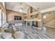 Bright living room featuring a fireplace, mounted TV, and comfortable seating area at 3525 Dover Bay St, Las Vegas, NV 89129