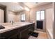 Bathroom with a double-sink vanity, framed mirror and bath tub at 363 Terrill Ave, Las Vegas, NV 89183