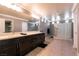 Modern bathroom with double vanity, sleek fixtures, and glass-enclosed shower at 363 Terrill Ave, Las Vegas, NV 89183