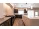 Well-equipped kitchen with island, dark cabinetry, and granite countertops at 363 Terrill Ave, Las Vegas, NV 89183