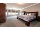 Spacious main bedroom with ample natural light and an elegant dark wood furniture set at 363 Terrill Ave, Las Vegas, NV 89183