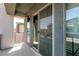 Covered balcony featuring exterior access via glass sliding doors and view of the neighborhood at 363 Terrill Ave, Las Vegas, NV 89183