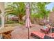 Paved backyard with brick privacy wall, lounge chairs and mature landscaping at 3735 Morning Canyon St, Las Vegas, NV 89147