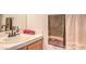Bathroom with a white sink, light wood cabinets, and decorative towels hanging on the wall at 3735 Morning Canyon St, Las Vegas, NV 89147