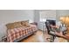 Bedroom featuring a single bed, desk, and light wood laminate flooring at 3735 Morning Canyon St, Las Vegas, NV 89147