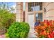 Charming front entrance with vibrant landscaping around the front door at 3735 Morning Canyon St, Las Vegas, NV 89147