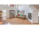 Bright living room featuring light hardwood floors, a charming fireplace, and an abundance of natural light at 3735 Morning Canyon St, Las Vegas, NV 89147