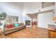 Bright living room featuring light hardwood floors, a charming fireplace, and an abundance of natural light at 3735 Morning Canyon St, Las Vegas, NV 89147