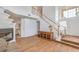 Spacious living room features high ceilings, a charming fireplace, and a staircase leading to the second floor at 3735 Morning Canyon St, Las Vegas, NV 89147