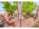 Private patio with shade trees and comfortable seating is perfect for outdoor entertaining and relaxation at 3735 Morning Canyon St, Las Vegas, NV 89147