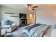 Bright and airy main bedroom with a ceiling fan, comfortable seating, and ample natural light at 3903 Ramura Ave, North Las Vegas, NV 89084