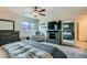 Spacious main bedroom featuring a ceiling fan, wall mounted TV, and calming neutral tones at 3903 Ramura Ave, North Las Vegas, NV 89084
