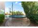Backyard featuring a trampoline, desert landscaping and a refreshing swimming pool at 3921 White Castle St, Las Vegas, NV 89129