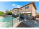 Two story home featuring backyard pool with patio and desert landscaping at 3921 White Castle St, Las Vegas, NV 89129