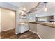 Charming bar area featuring a sink, wine rack, and stylish pendant lighting, perfect for entertaining guests at 3921 White Castle St, Las Vegas, NV 89129