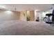 Spacious basement area with neutral carpet, stairs, and home gym equipment at 3921 White Castle St, Las Vegas, NV 89129