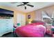 Bright bedroom featuring modern furniture, a ceiling fan, and natural light for a peaceful retreat at 3921 White Castle St, Las Vegas, NV 89129
