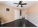 The clean lines, ceiling fan, and hardwood floors make this bedroom ready for its new owners at 3921 White Castle St, Las Vegas, NV 89129
