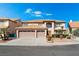 Lovely two-story home featuring a three-car garage, mature landscaping, and an eye-pleasing terracotta-colored roof at 3921 White Castle St, Las Vegas, NV 89129