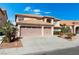 Charming two-story home highlighting a spacious three-car garage and well-manicured front yard at 3921 White Castle St, Las Vegas, NV 89129