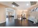 Upstairs hallway featuring dark wood floors and stylish wrought iron railing with bench seating at 3921 White Castle St, Las Vegas, NV 89129