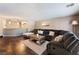Cozy living room with a large sectional sofa, coffee table, and view of the bar area at 3921 White Castle St, Las Vegas, NV 89129