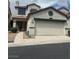 Two-story home with stucco exterior, red tile roof, and two-car garage at 4017 Radbourne Ave, Las Vegas, NV 89121
