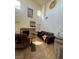 Spacious living room with tall ceilings, tile floors, and a fireplace at 4017 Radbourne Ave, Las Vegas, NV 89121