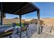 Outdoor patio with comfortable seating, pavers, turf and covered dining area at 4066 Painted Lady Ave, Las Vegas, NV 89141
