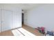This bedroom has a fan, lots of light and light wood floors at 4066 Painted Lady Ave, Las Vegas, NV 89141